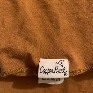 Copper Pearl swaddle in the color “Camel”